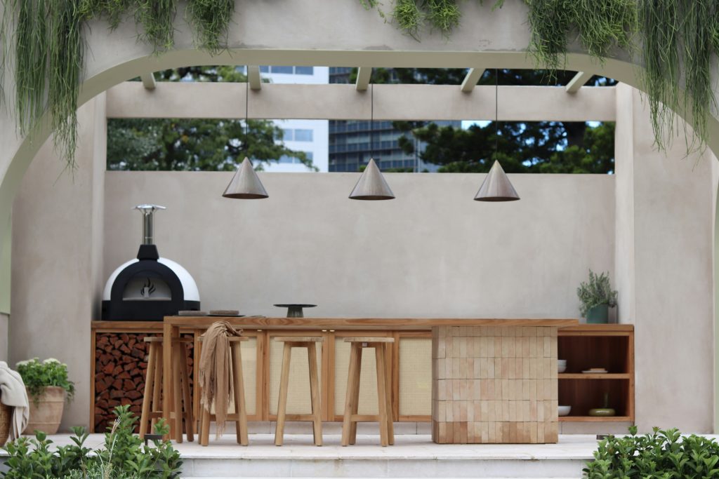 Photo by <a href="https://unsplash.com/@cjentus16?utm_content=creditCopyText&utm_medium=referral&utm_source=unsplash">Michael Shu</a> on <a href="https://unsplash.com/photos/a-patio-with-a-table-and-chairs-and-a-grill-uZv7TAsig-E?utm_content=creditCopyText&utm_medium=referral&utm_source=unsplash">Unsplash</a>