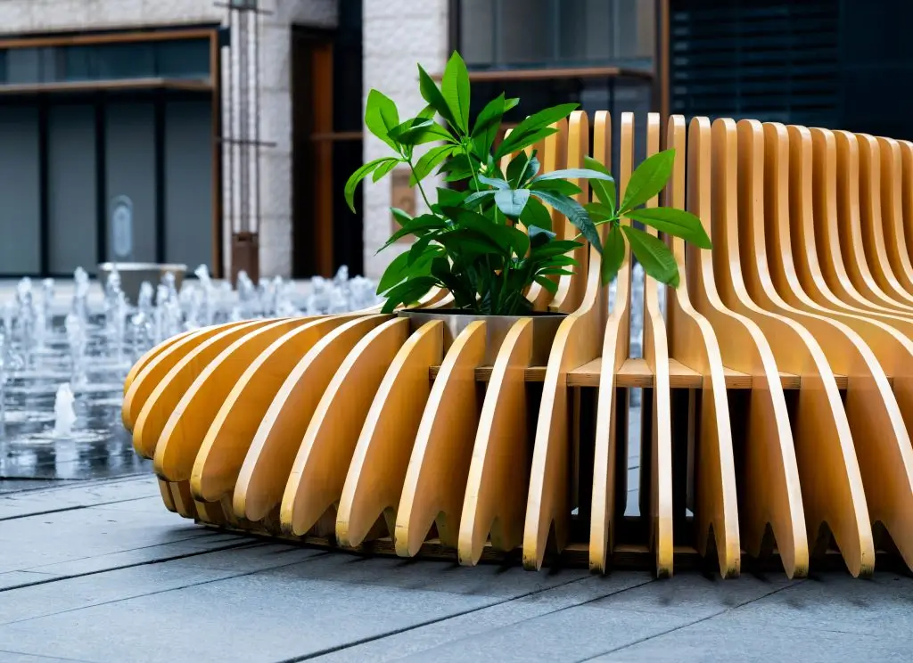 Wooden bench with a potted plant — simple, natural deck decor