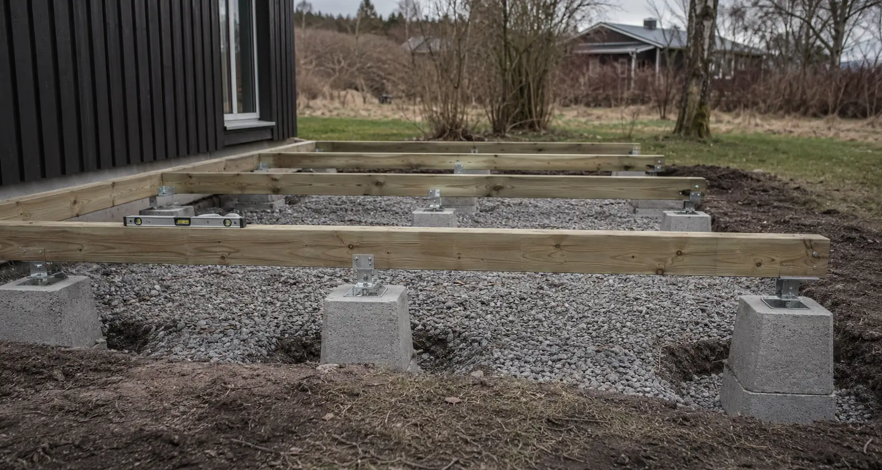 Deck footings and supports being prepared before framing